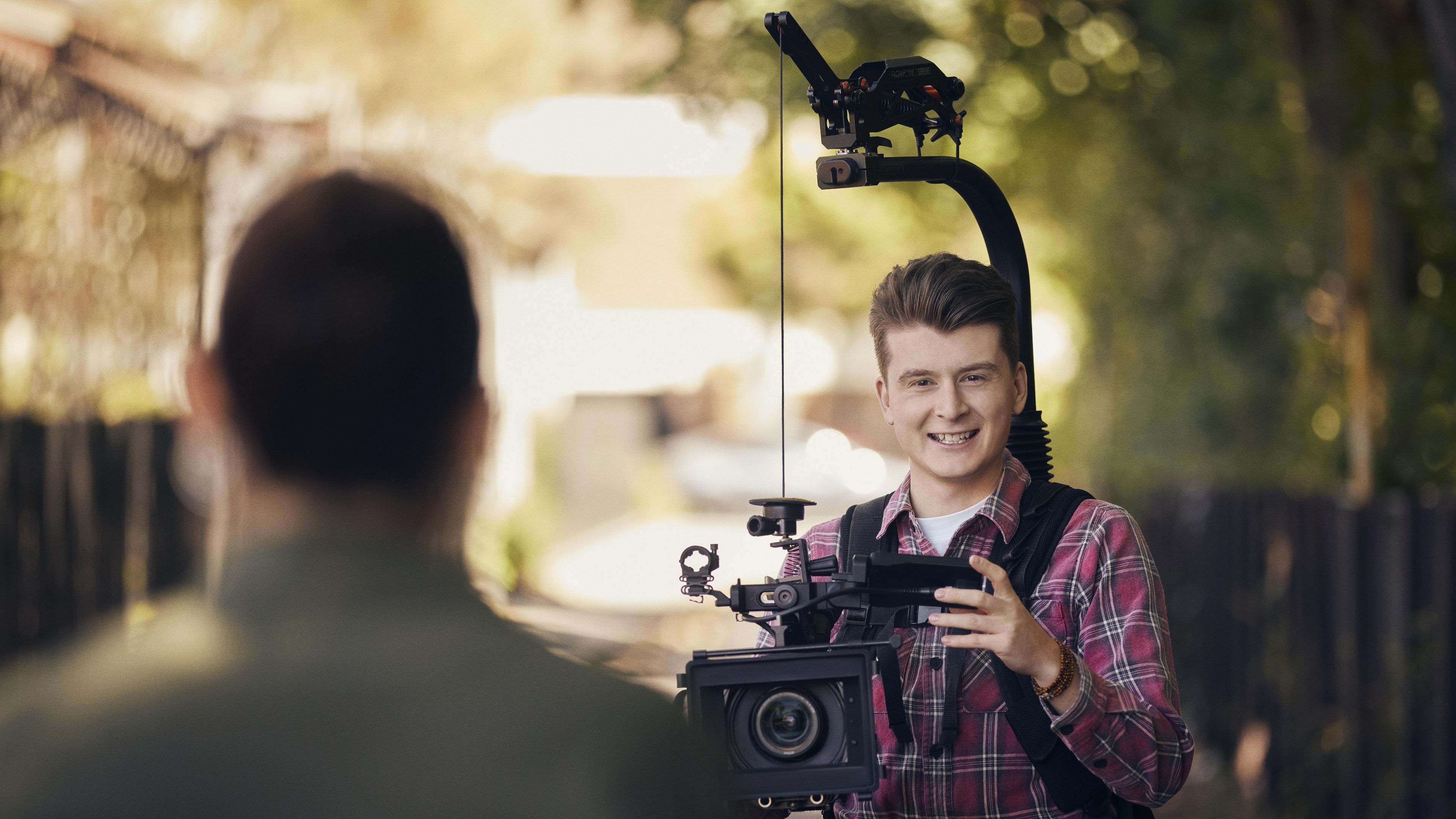 Certificate IV in Screen and Media student Bailey is filming his fellow student as part of his TAFE course on Swinburne's leafy Hawthorn campus.