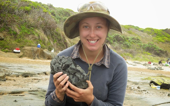 Jessica Parker with elaphrosaur fossil at Eric the Red dinosaur dig site near Cape Otway