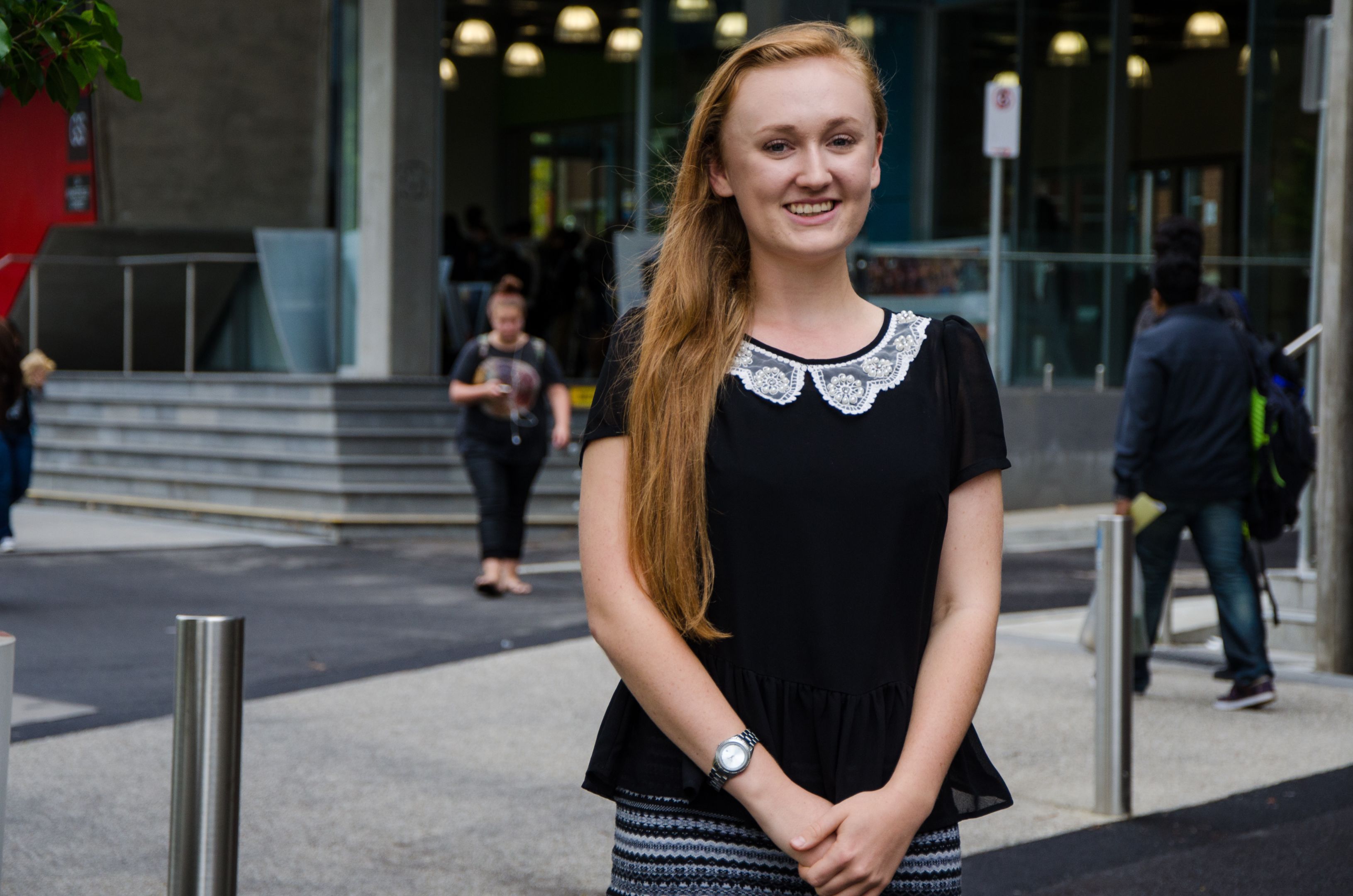 Female student smiling to camera on Swinburne campus