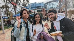 Students posing with skewers at Swinburne Hawthorn campus event