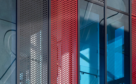 Close up image of the George Swinburne building, with the Swinburne logo in reflection