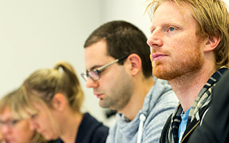 Group of men and women in class