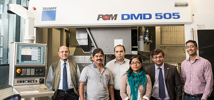 Swinburne team in front of the DMD505 Direct Metal Deposition system