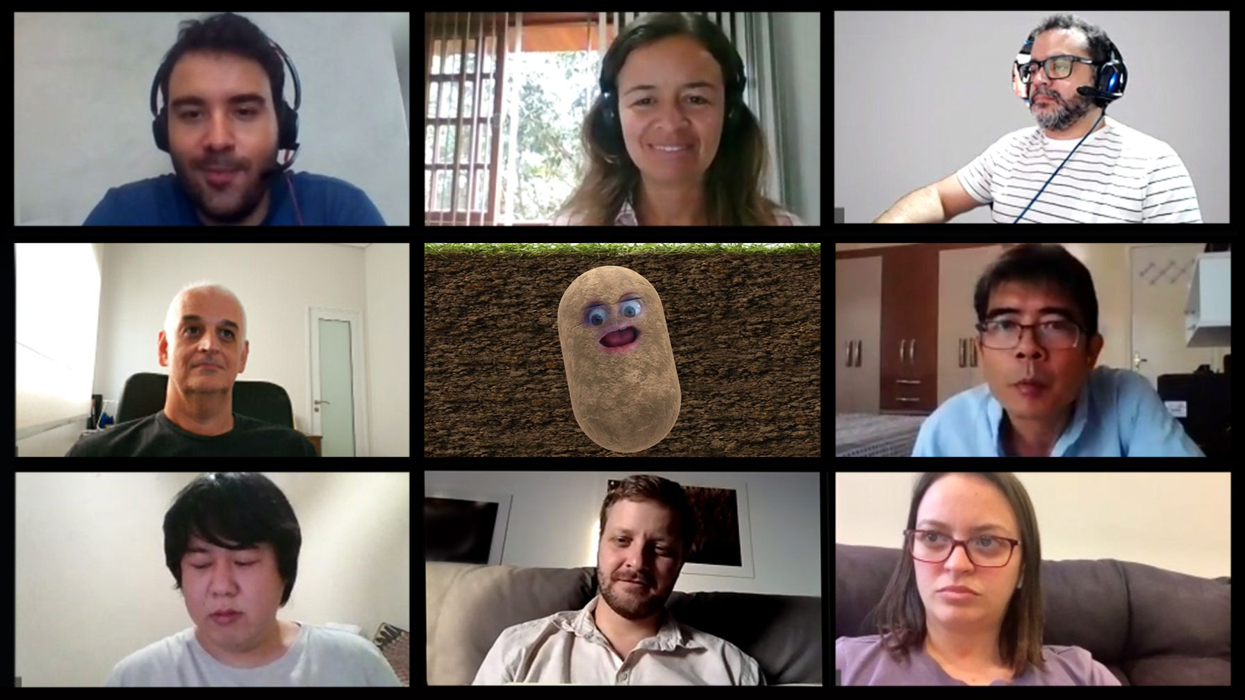 Nine people in a work video meeting, the middle one has a potato filter over their face.