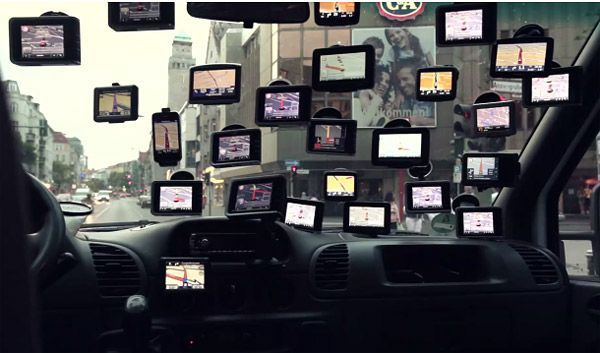 View from inside a car with twenty GPS devices suction-cupped to the windscreen.