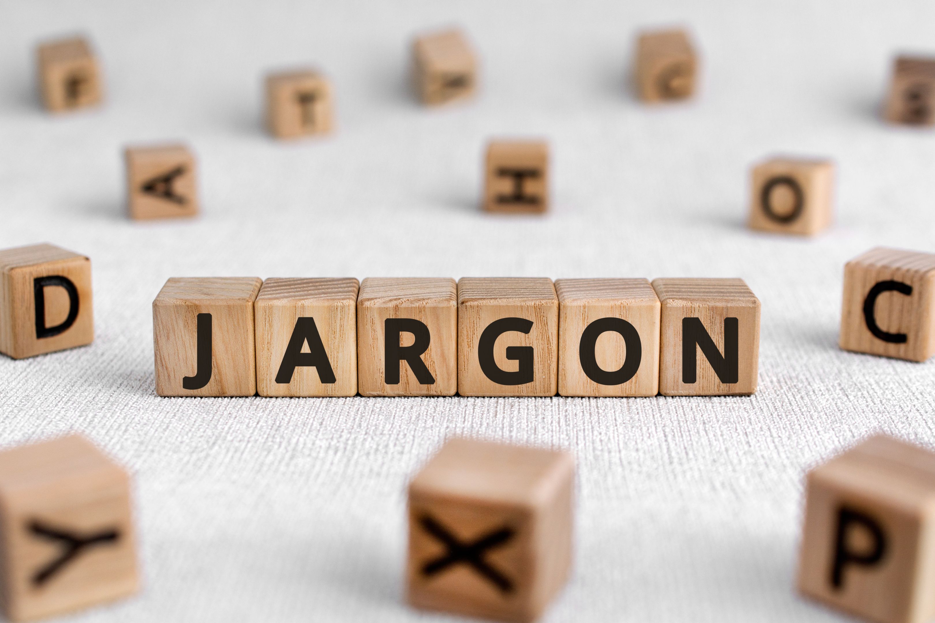 Scrabble tiles spell out the word ‘JARGON’. 