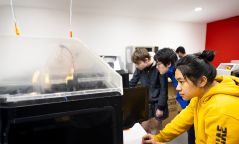 Students using equipment 