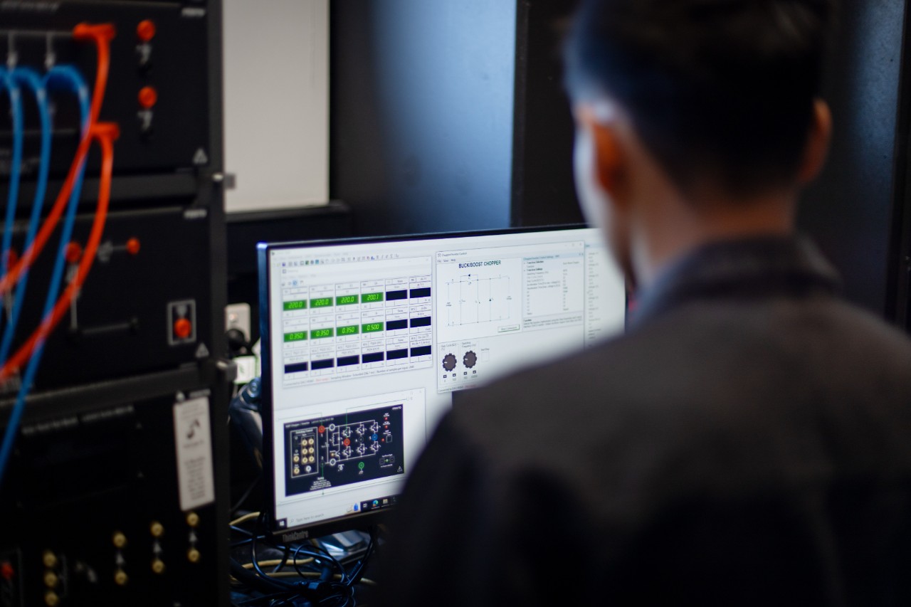 A student using LVDCAD software on a computer