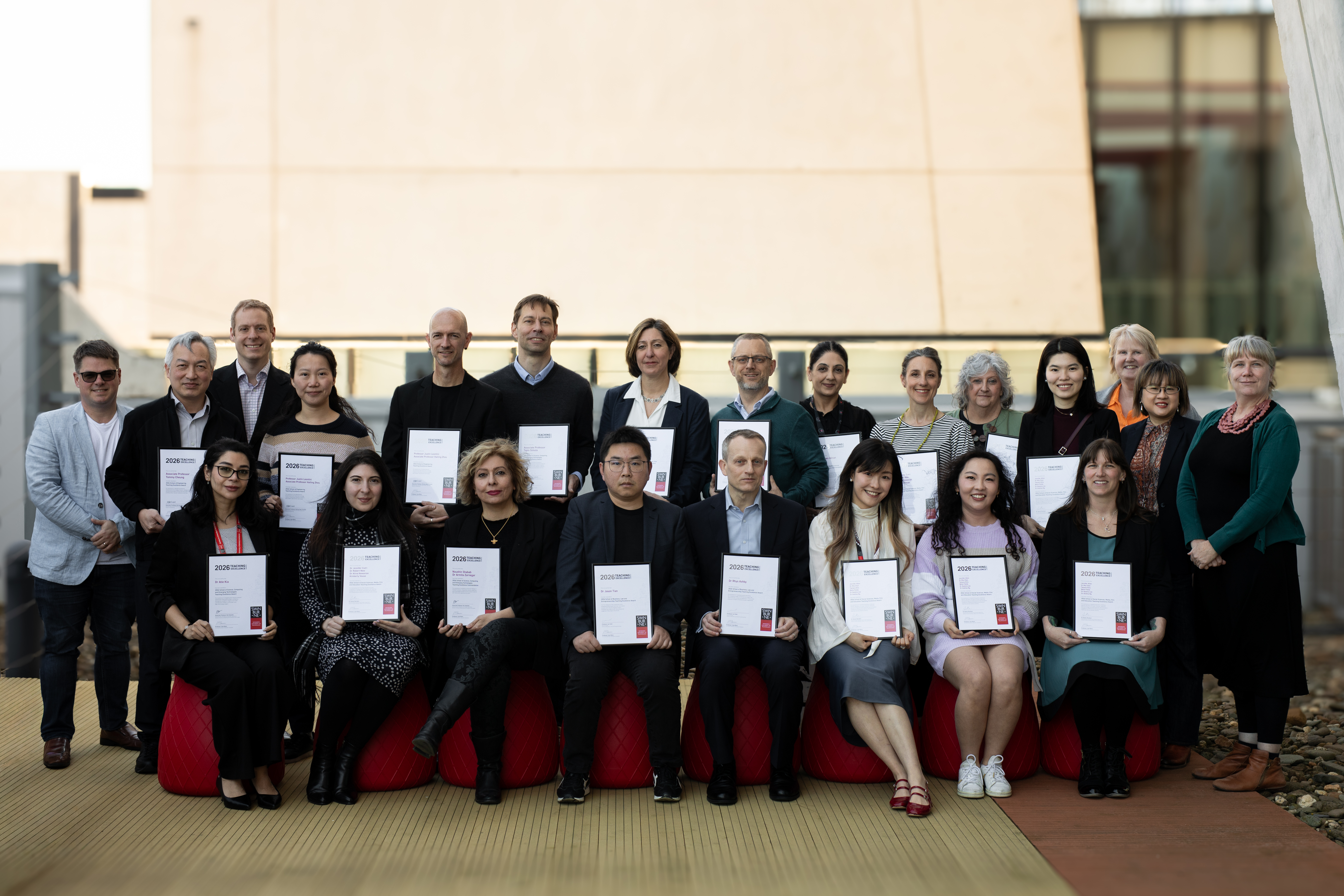 A group photo of the 2026 School Teaching Excellence Award Recipients holding their certificates pictured with university leaders