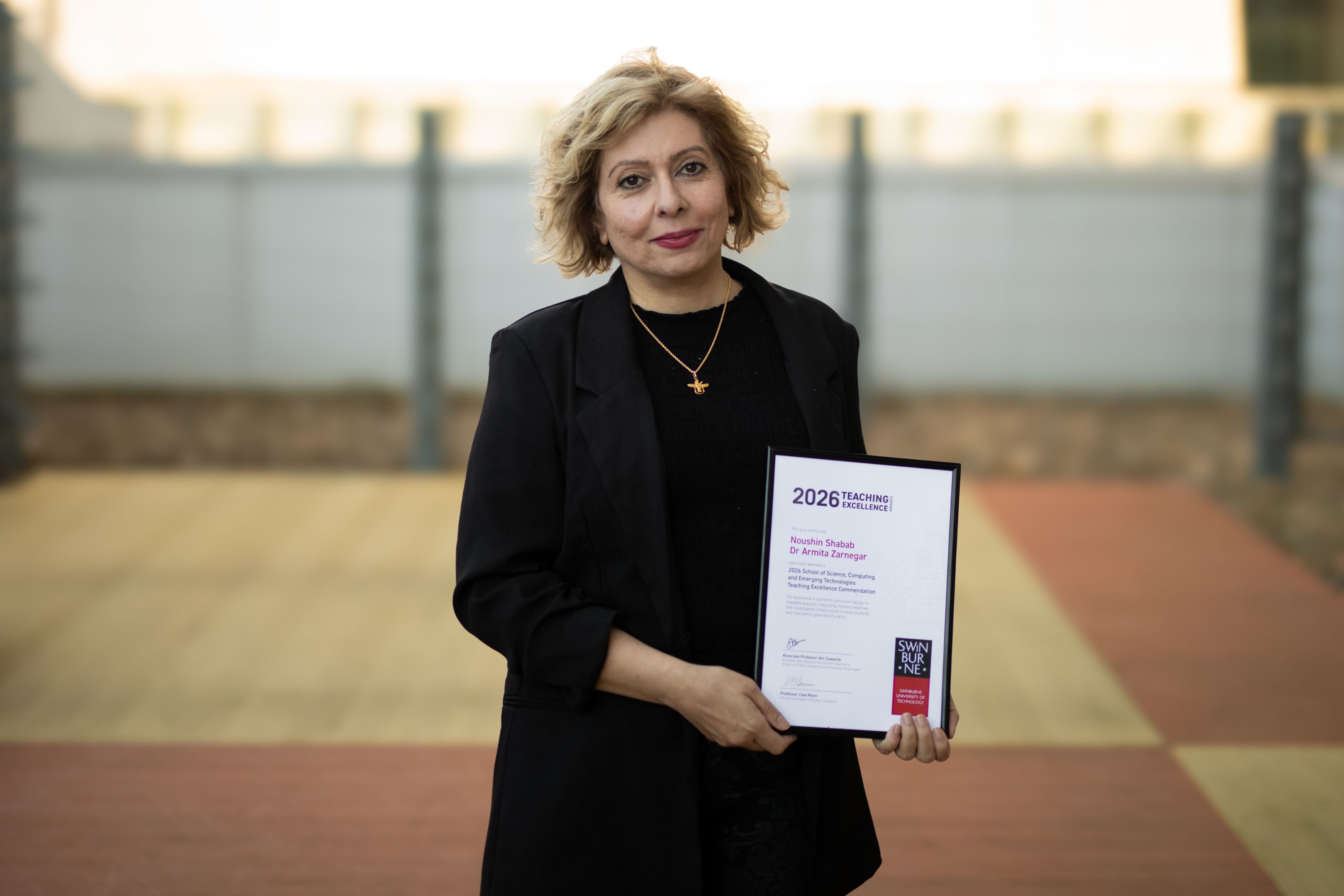 2026 School Teaching Excellence Award recipient Noushin Shabab holding her certificate