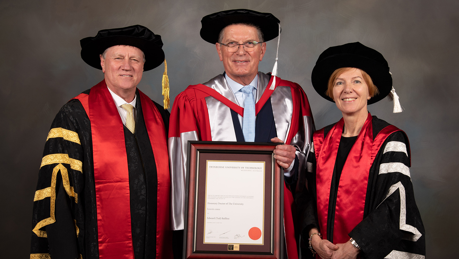 Chancellor Professor John Pollaers, Ted Baillieu and Vice-Chancellor Pascale Quester in academic regalia at August 2022 graduations