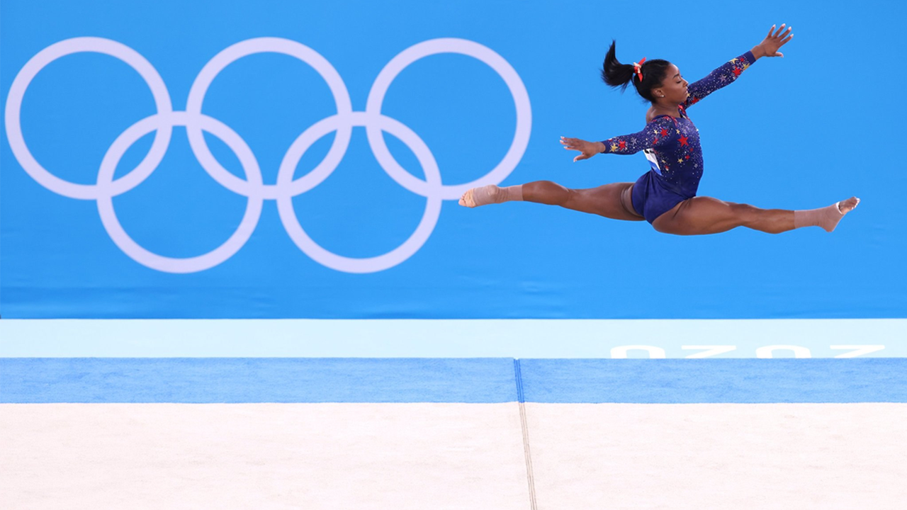 Simone Biles leaping in event at Olympics