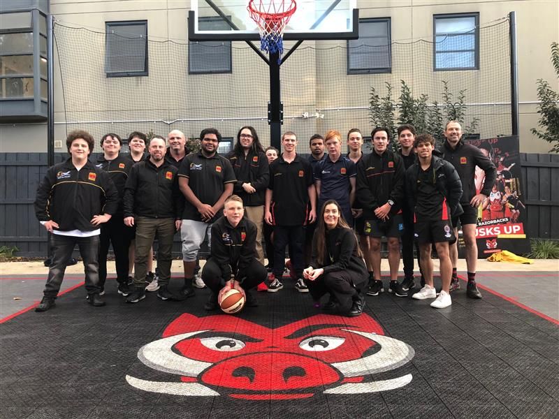 Clontarf students pose for a photo on the half basketball court  at Swinburne's Hawthorn campus
