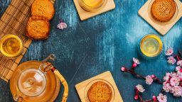 Mooncakes and tea on a table for Mid-Autumn Festival