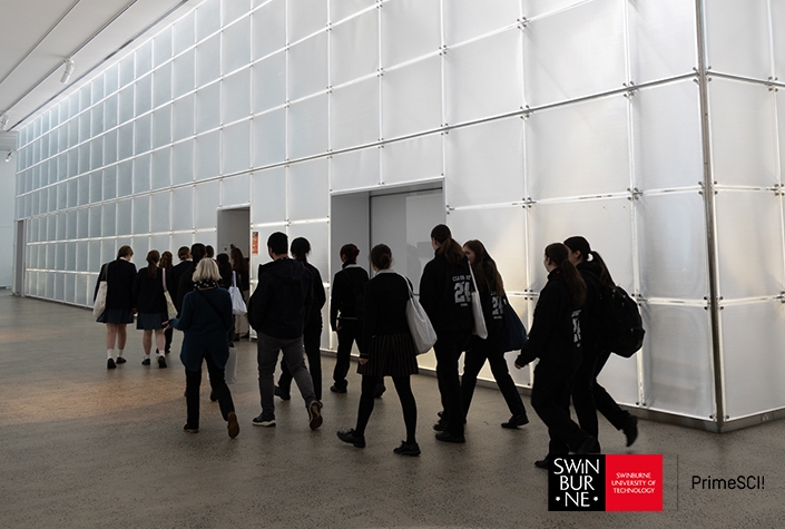 group of students walking to a classroom