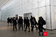 group of students walking to a classroom