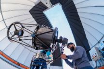 Astronomer in photo telescope dome