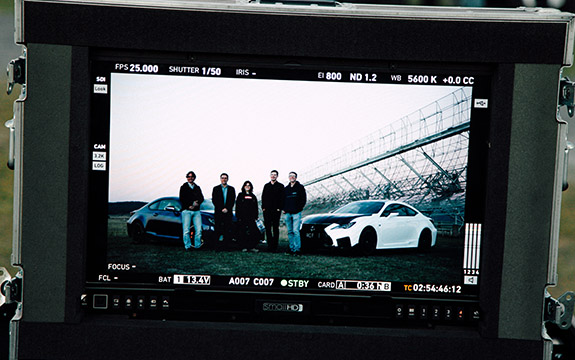 Swinburne and Lexus staff on a camera monitor. 