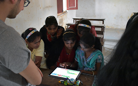 Indian students looking at tablet