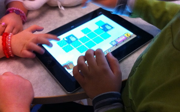 Kids using an iPad