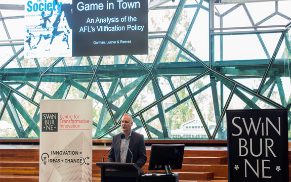 Dean Lusher presents at the AFL book launch at federation square