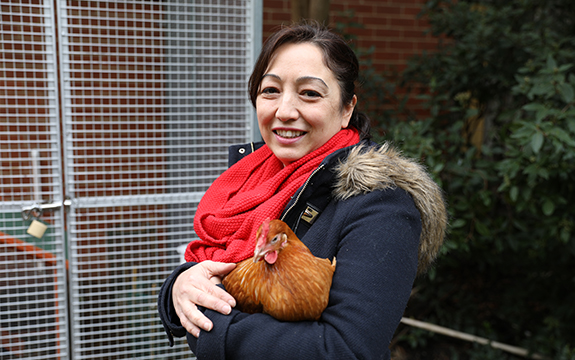 Senior Operations Coordinator, Suzie Roach, with one of Swinburne Student Residences' pet chickens.