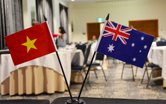 Australian and Vietnamese flags on table