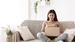 Girl browsing online on laptop