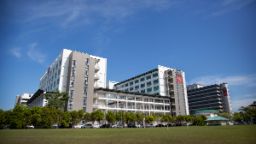 A modern white and grey university building.