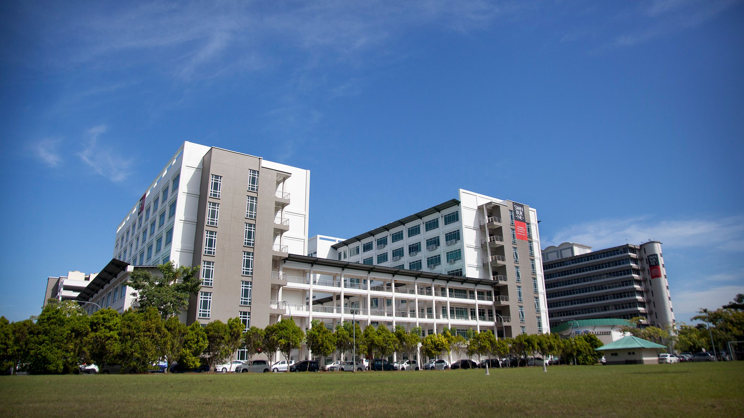 A modern white and grey university building.