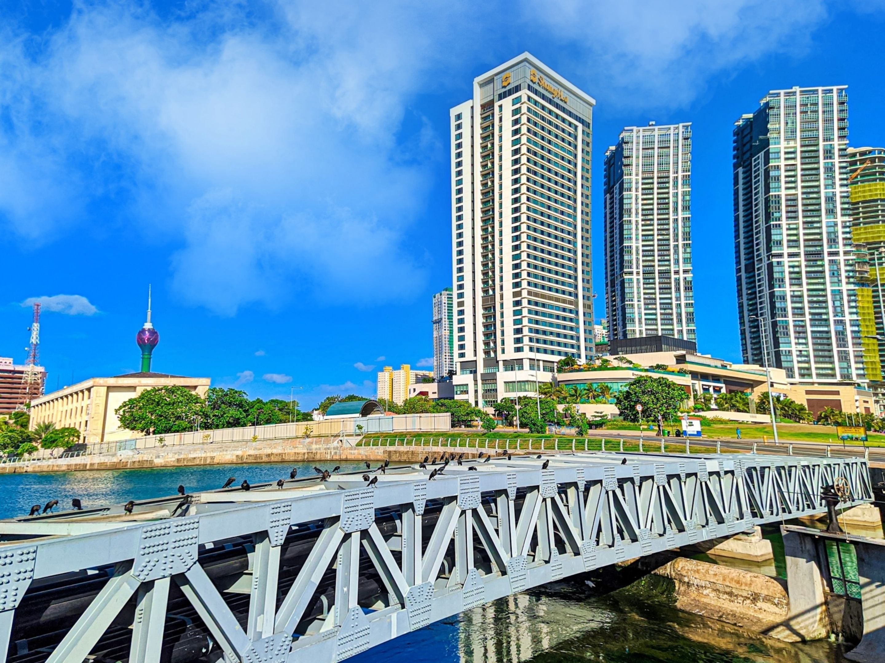 Image of city of Colombo Sri Lanka with bridge and tall buildings.