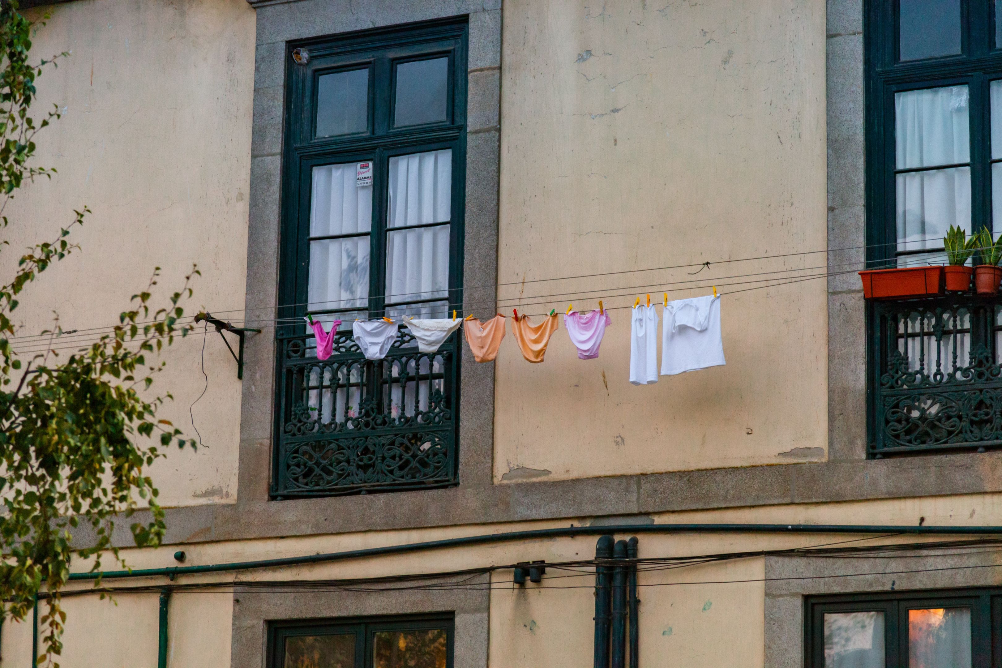 A string of colourful underwear on a street-facing washing line