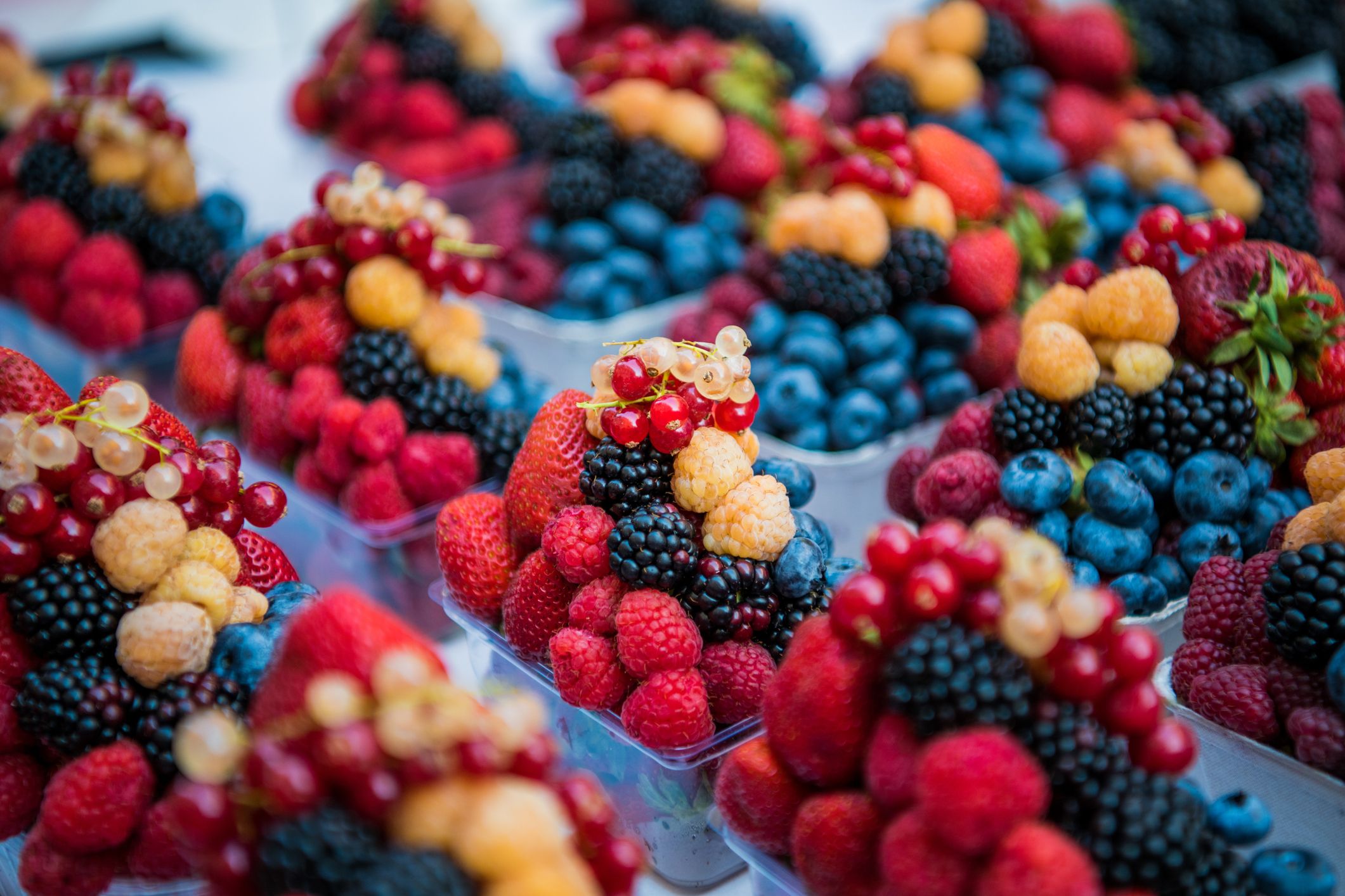 Fruits, berries and vegetables on the counter at the street market