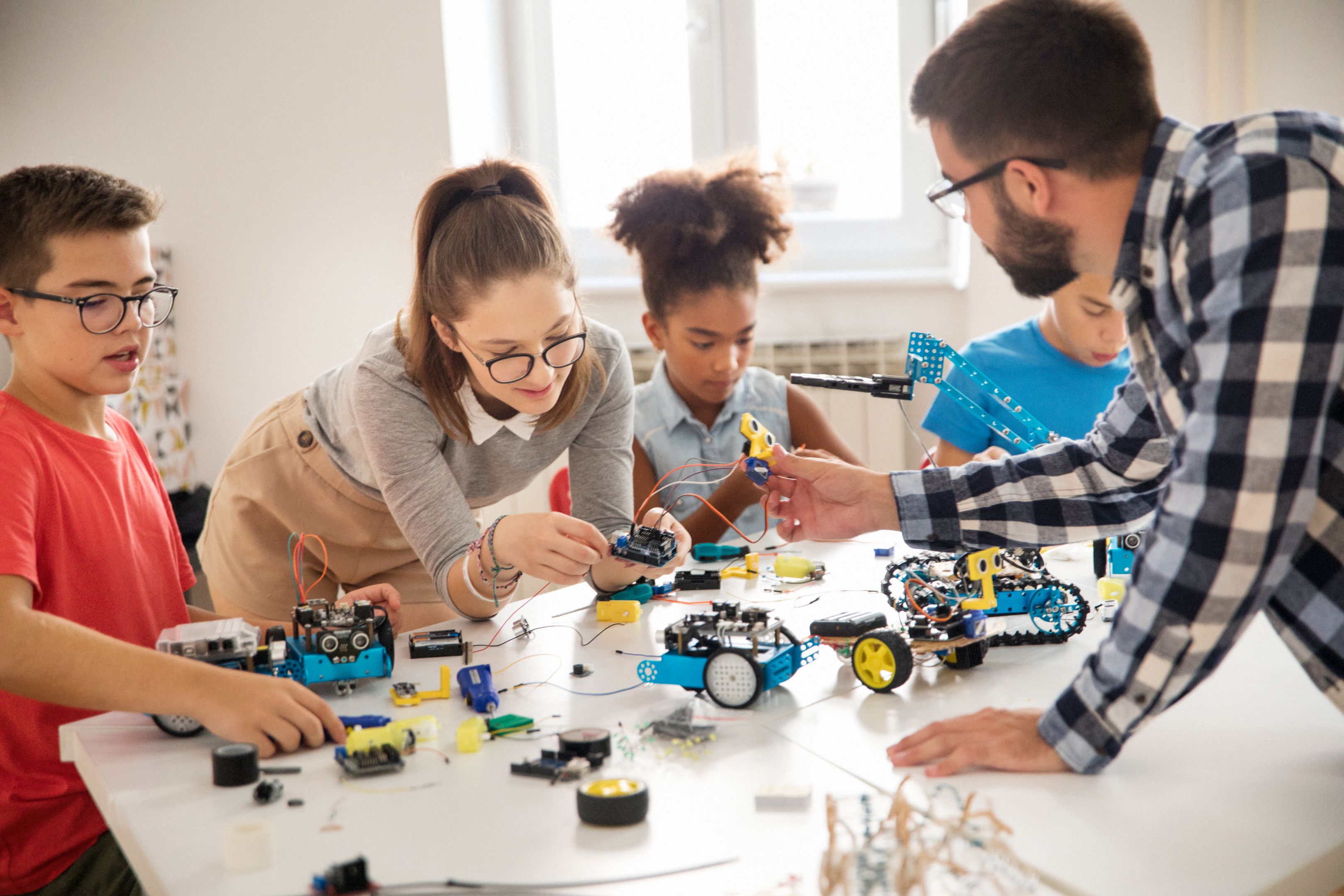 Kids working on a robot design