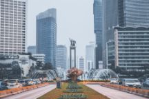 fountain in foreground framed either side and behind by skyscrapers in Jakarta, Indonesia