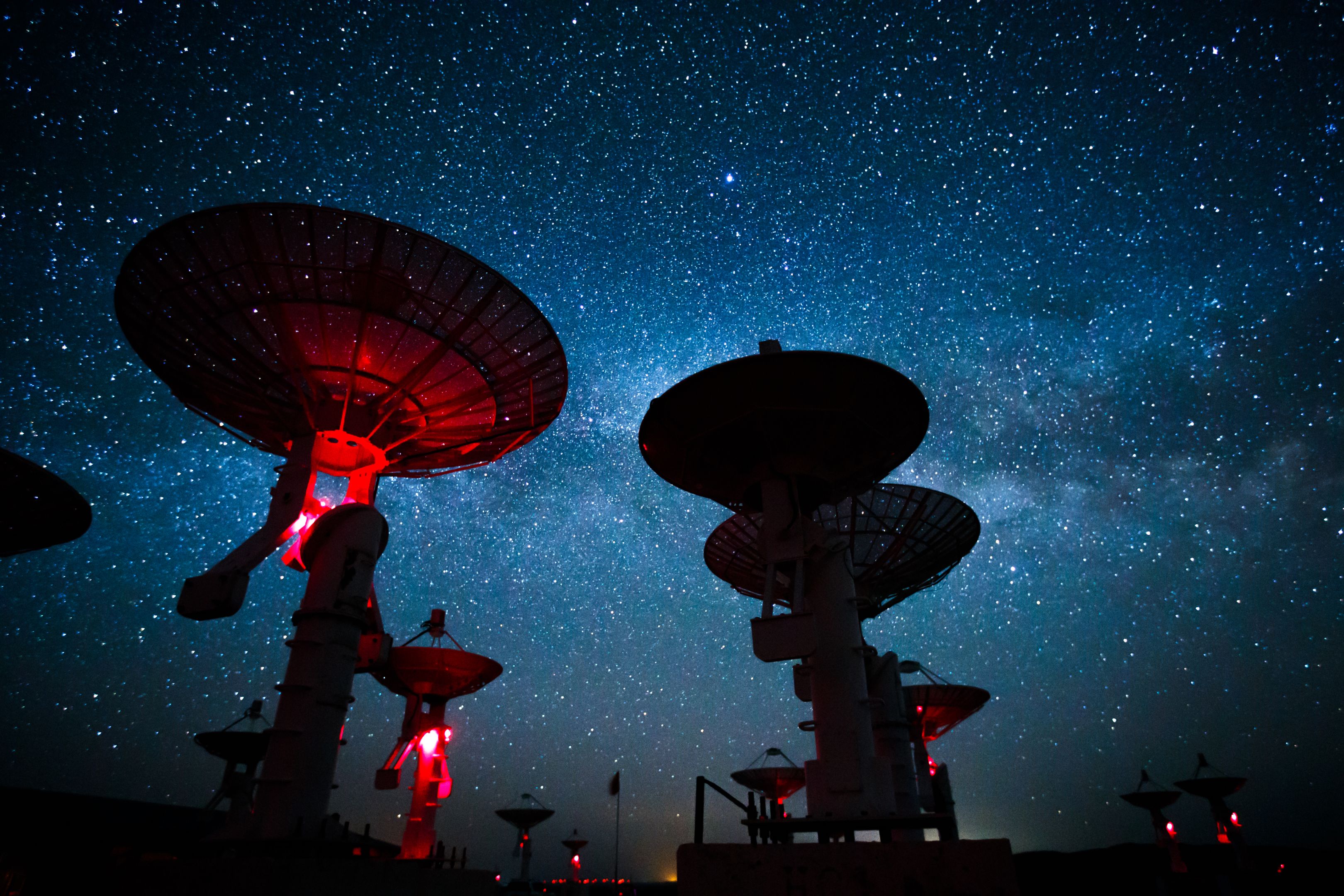 Milky Way galaxy over the satellite receiving station.
