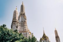 Image of trees and Wat Arun Temple in Bangkok Thailand