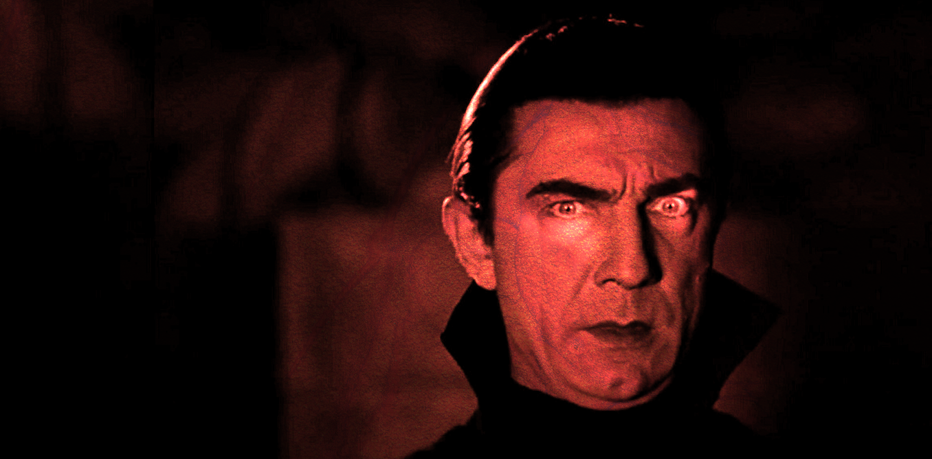 Bela Lugosi playing Count Dracula in 1931, wearing a black robe and lit up with a red light.