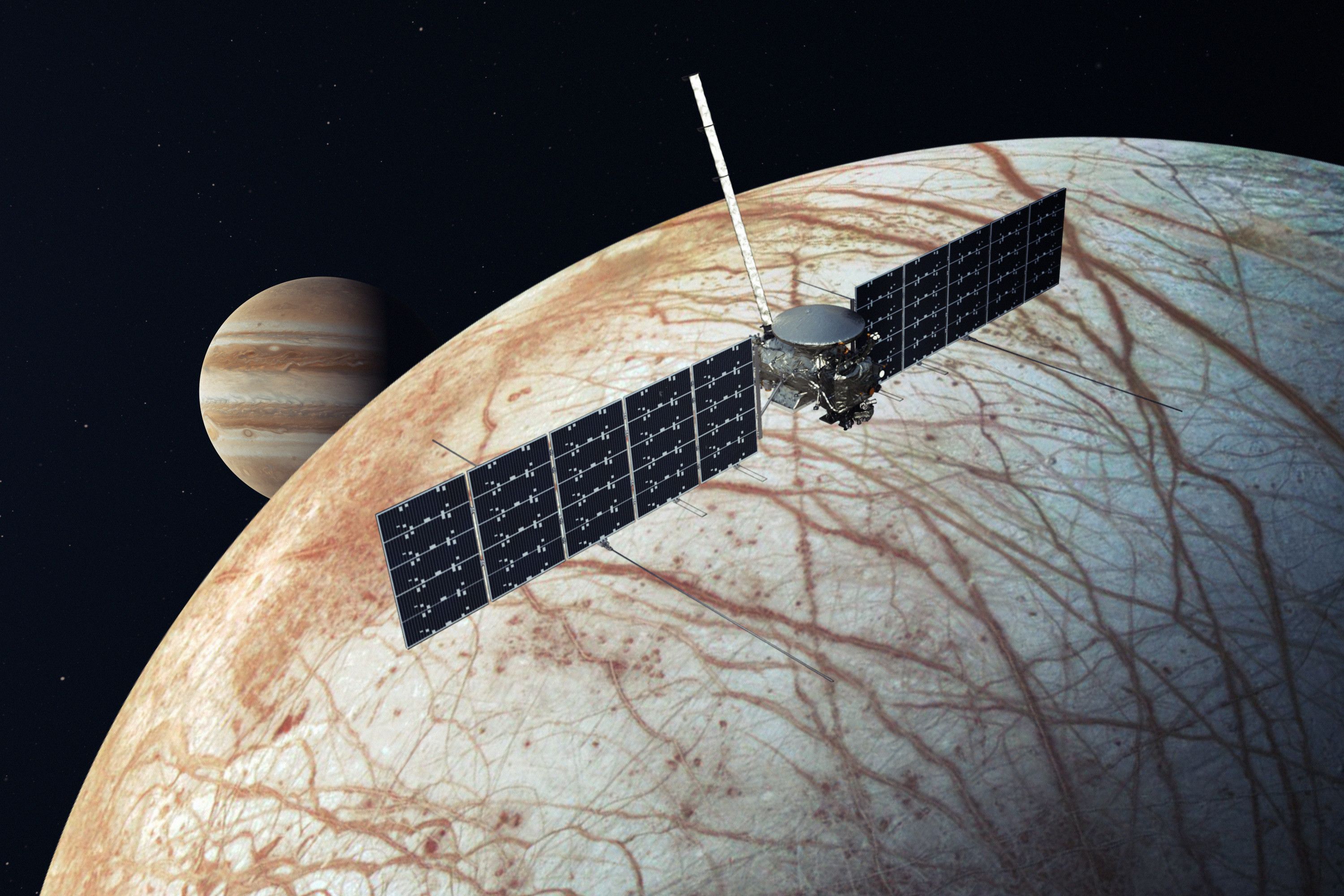 The concept art of the Europa Clipper mission under development showing a satellite in space next to Jupiter and the icy moon Europa