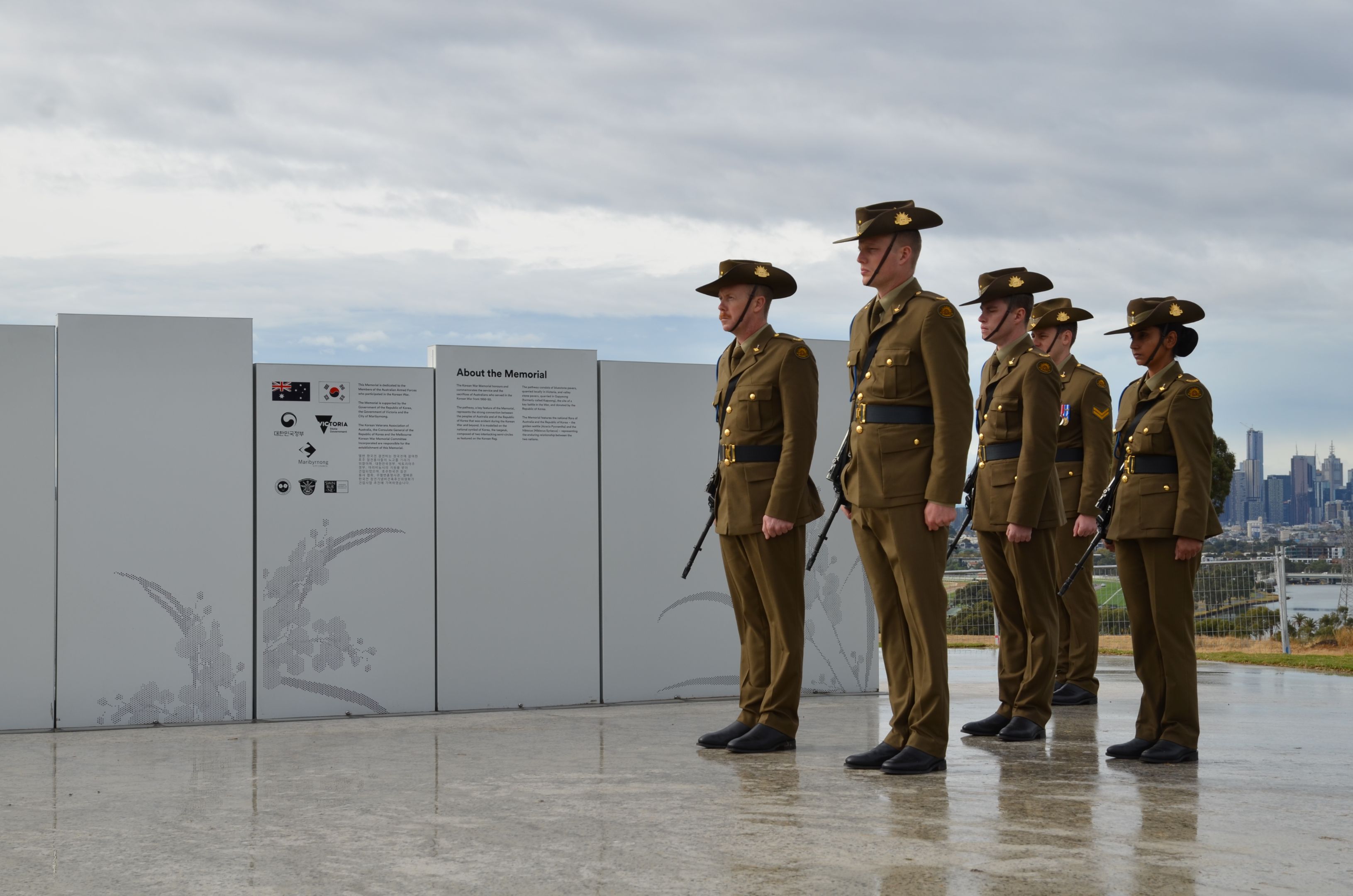 Soldiers standing in front of the Melbourne Korean War Memorial