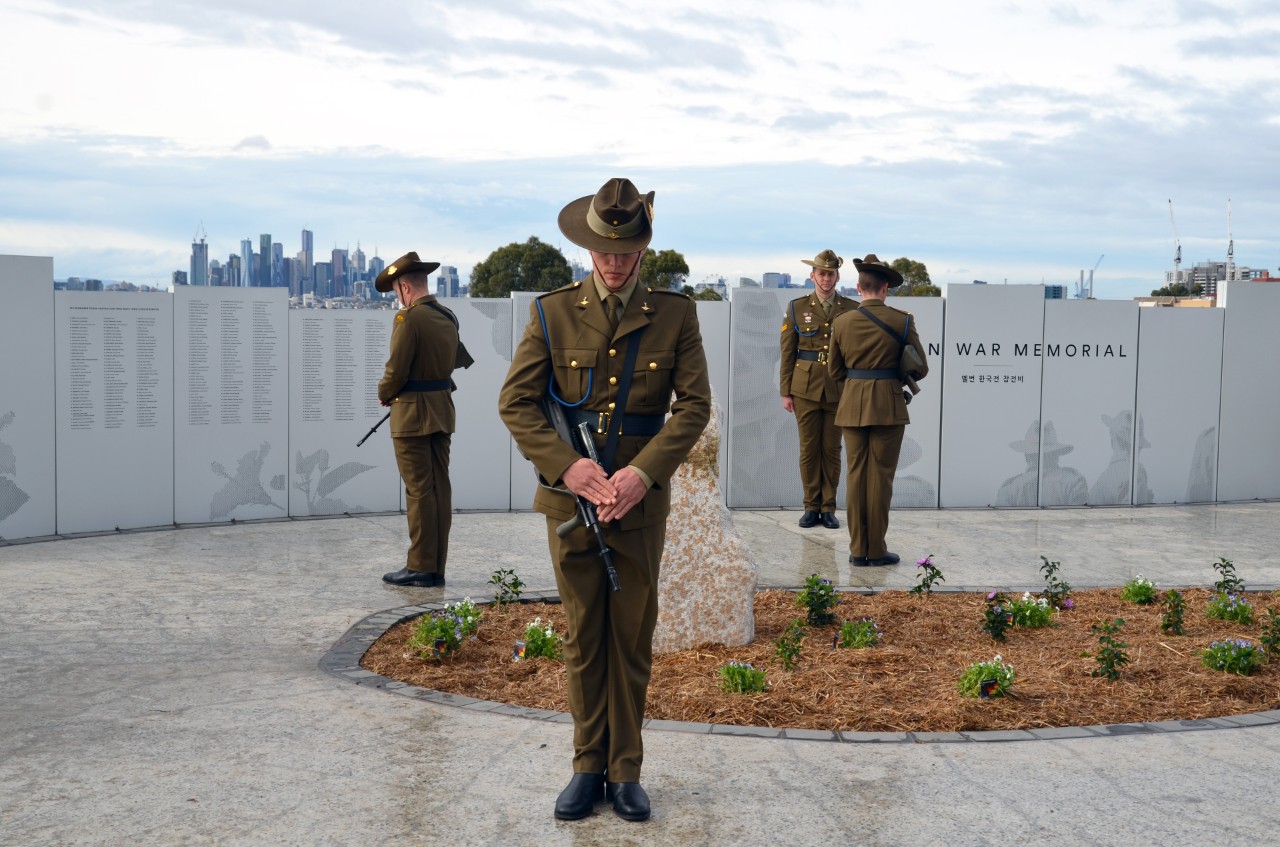 Soldiers standing in front of the Melbourne Korean War Memorial