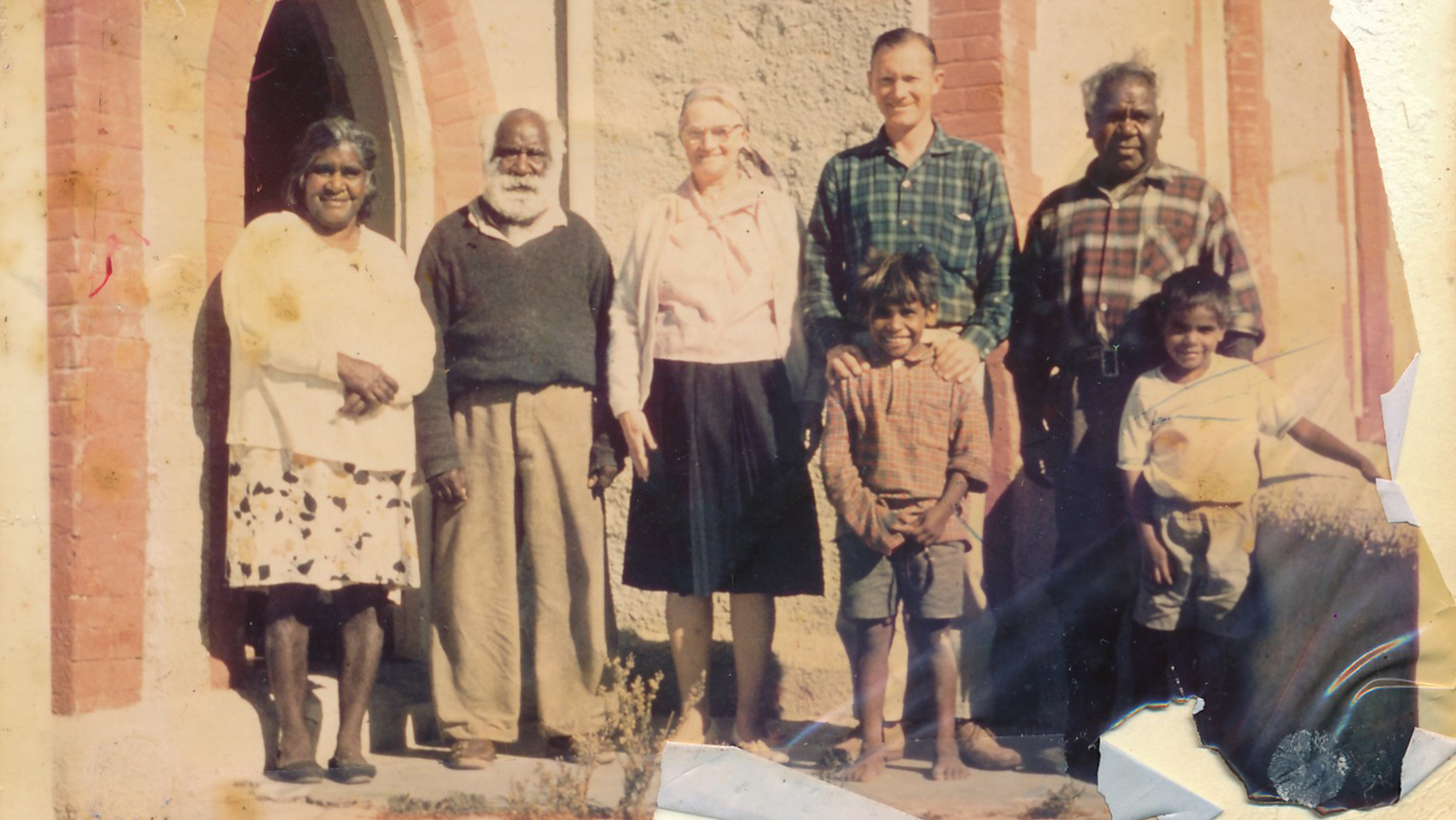 Group of people standing outside Raukkan Hall circa 1940s