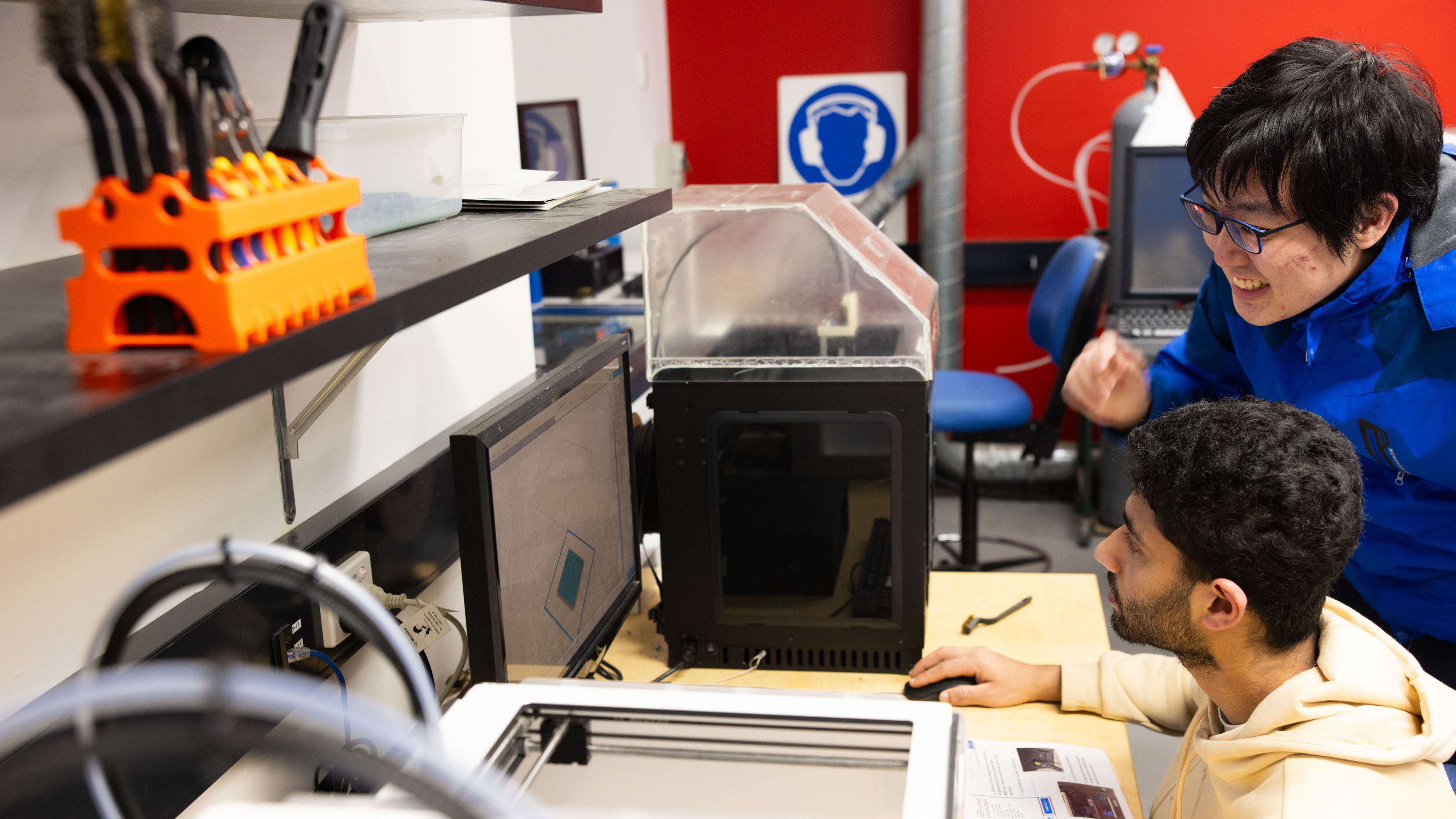 Students using equipment in an applied mechanics laboratory.