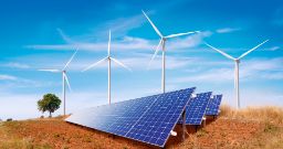 Solar Panels and Wind Turbines on the Hill - Renewable Energy Concept