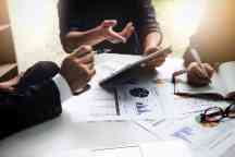 Business people in a meeting with important documents on the table. 