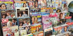 Print magazines on a shelf in a shop