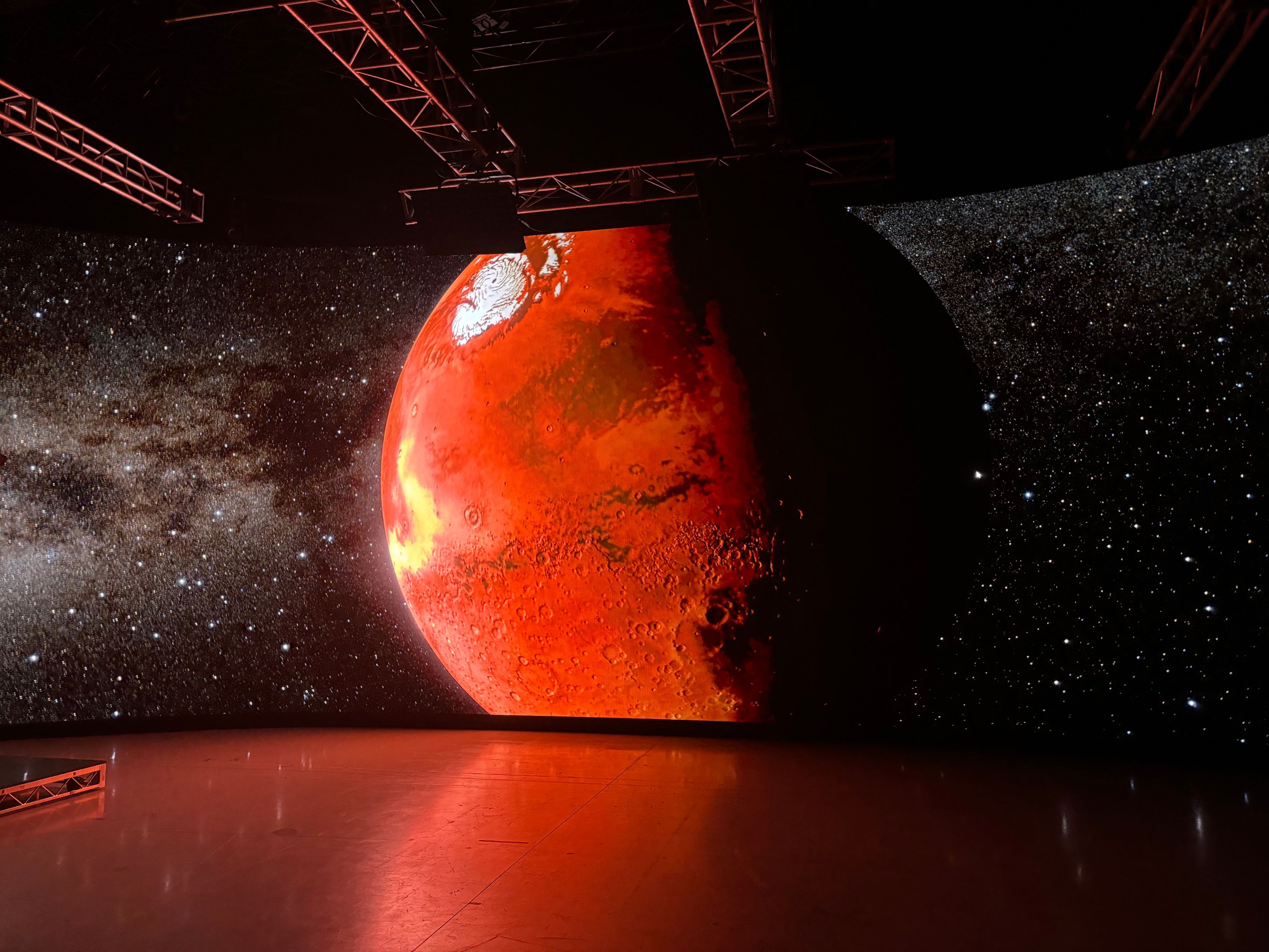 red planet on a screen in a dark room