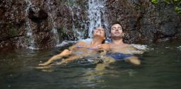 Man and woman in a natural water spring