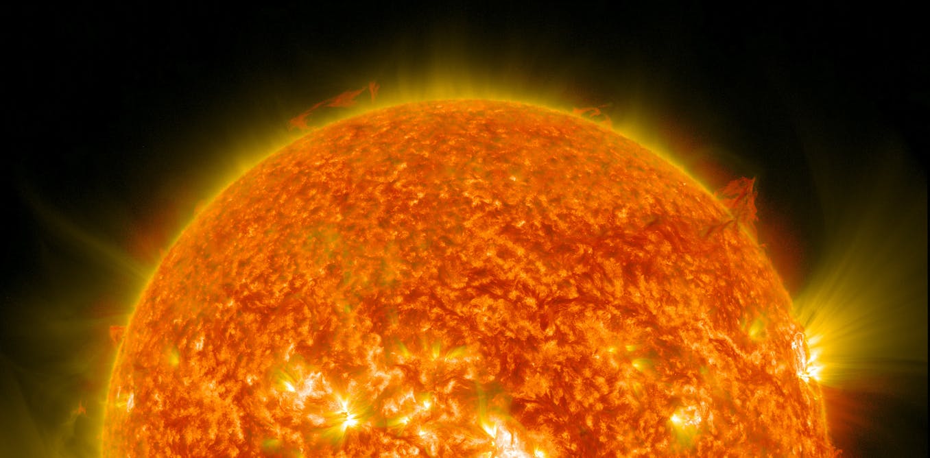 Image of the Sun from Nasa, burning bright red against the blackness of space.