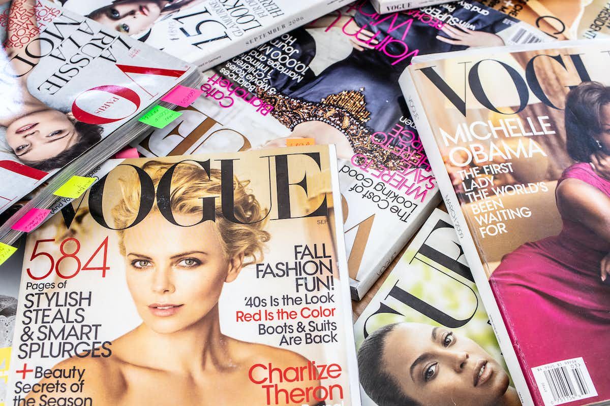 An array of Vogue magazines in a pile